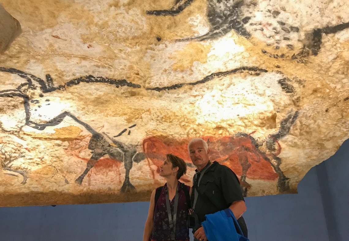 Netzin (left) and Dieter Steklis stand in front of a cave painting of an aurochs in Lascaux, a cave complex in southern France. The aurochs, a prehistoric ancestor of the cow, is the only animal that prehistoric people painted life-size. (Photo courtesy o