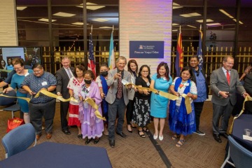Pascua Yaqui Tribe and University of Arizona leaders cut a ribbon to celebrate the grand opening of the University's newest microcampus, the first to serve an Indigenous tribe. (Photo by Chris Richards/University Communications)